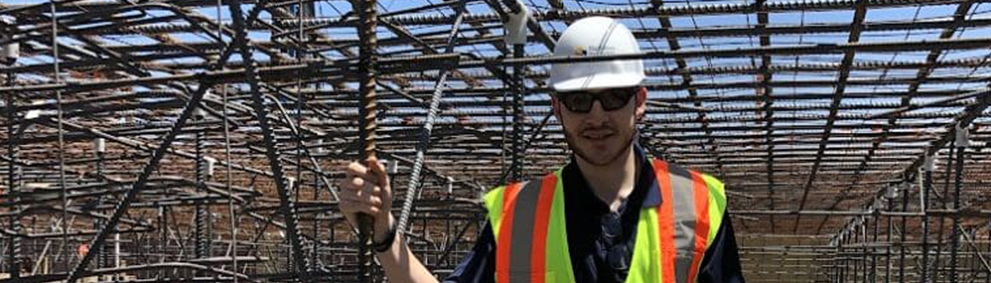 A photo of Jeremy Feist standing in a rebar structure