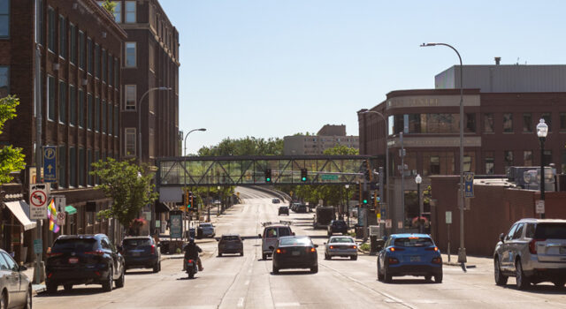 A photo of vehicles driving down a street in Downtown Sioux Falls SD